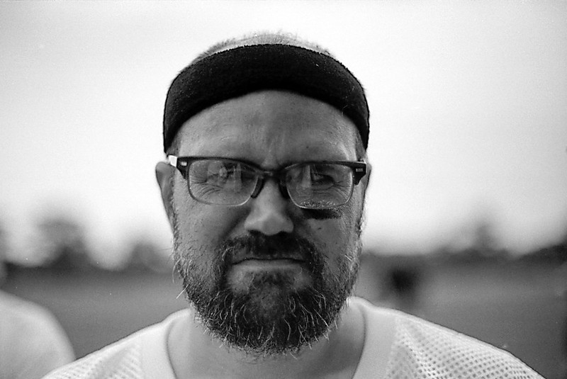Black and White portrait of Nate Beaty wearing black headband.